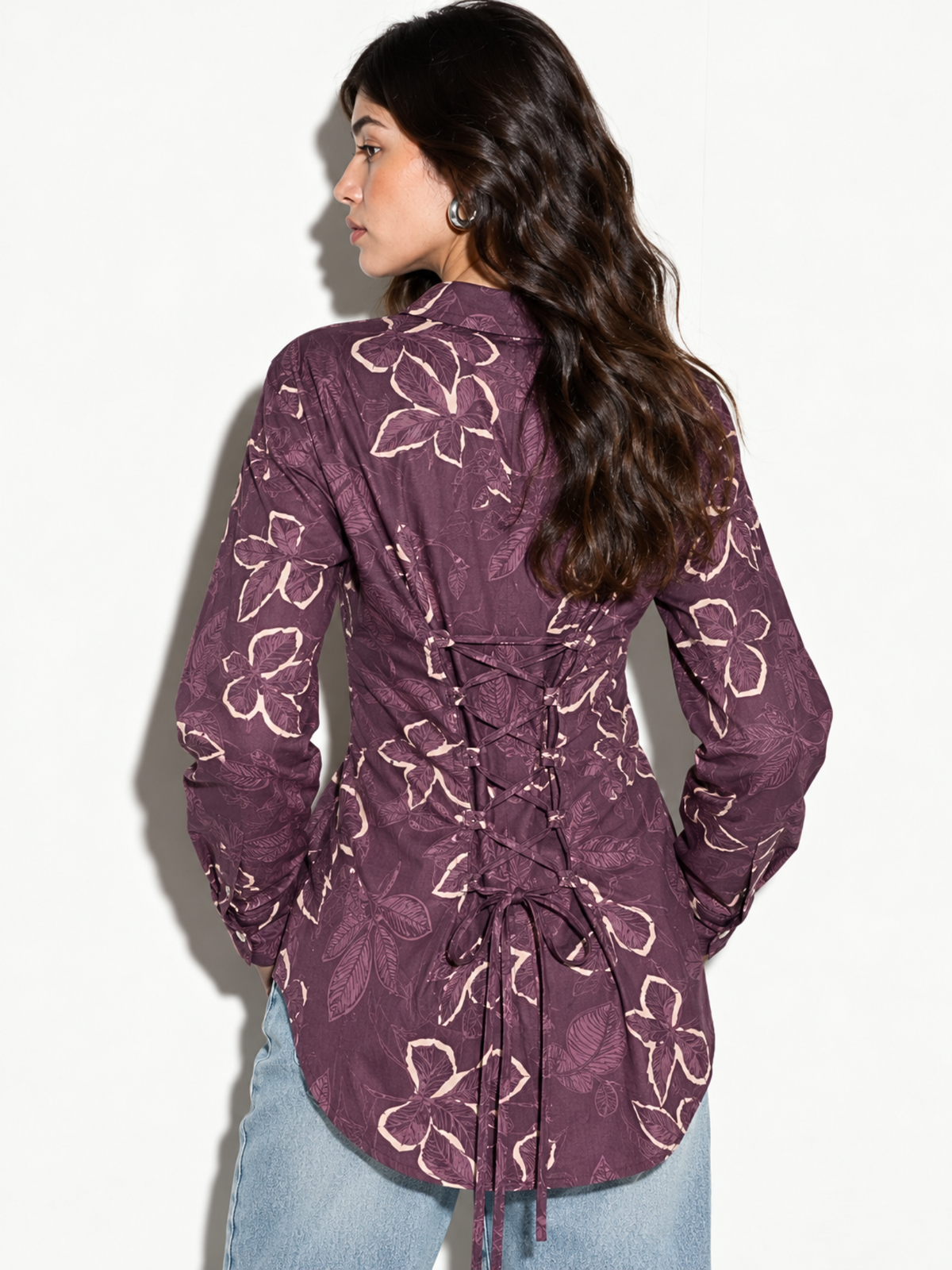 Back view of Leher mauve corset back shirt with lace-up panel and tie ends